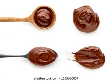 Chocolate nougat cream in spoons isolated on white background, top view