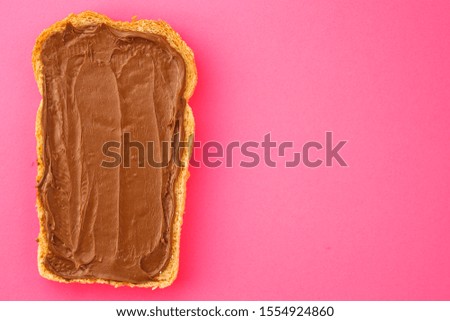 Similar – Image, Stock Photo Toasted toast bread in toaster on pink background