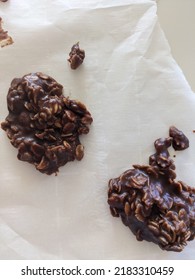 Chocolate Oatmeal Drop Cookies On Parchment Paper, Baking, Some Cookies Have Been Removed. No Bake Cookies