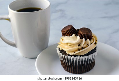 Chocolate Peanut Butter Cup Cake  With A Cup Of Coffee