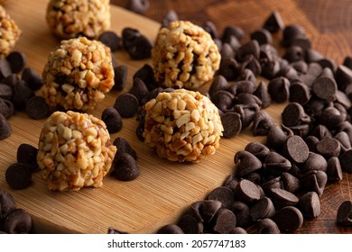 Chocolate Peanut Butter Energy Balls On Wooden Butcher Block
