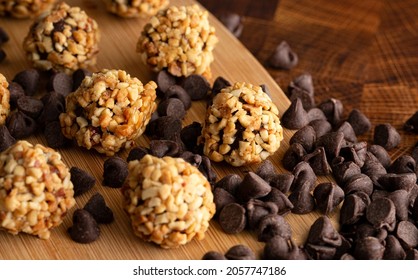 Chocolate Peanut Butter Energy Balls On Wooden Butcher Block
