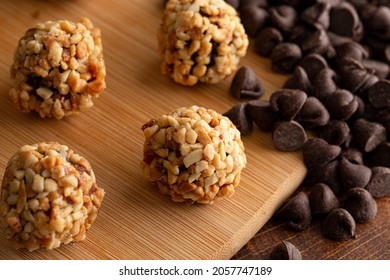 Chocolate Peanut Butter Energy Balls On Wooden Butcher Block
