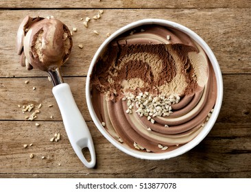 Chocolate And Peanut Ice Cream On Wooden Table, Top View