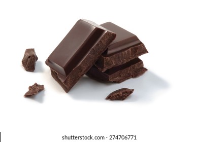 Chocolate pieces and chunks isolated on a white background.