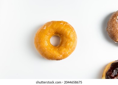 Chocolate And Plain Donut On White Background