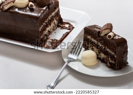 chocolate prestige cake, coconut and condensed milk , cake slice on a plate