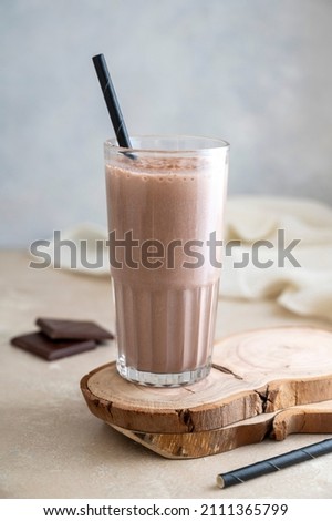 Chocolate protein drink in glass for nutrients and energy