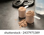 Chocolate protein powder in scoops. Food supplement, nutrition 