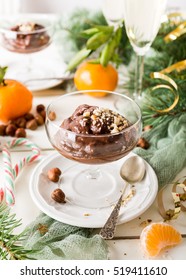 Chocolate Pudding Mousse With Avocado, Nuts And Christmas Decorations. Delicious Christmas Themed Dinner Table.