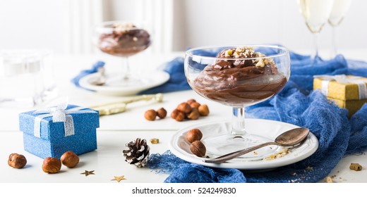 Chocolate Pudding Mousse With Avocado, Nuts And Holiday Decorations. Delicious Christmas Themed Dinner Table.