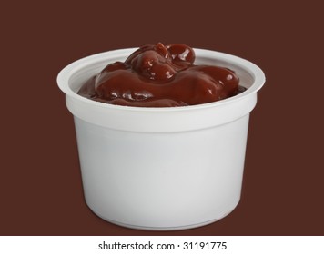 Chocolate Pudding In White Plastic Cup, Brown Background