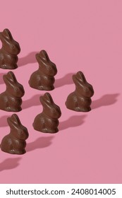 Chocolate rabbit pattern symbol to Easter holidays on a pink background