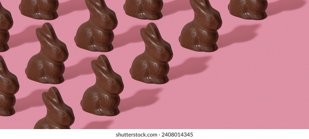 Chocolate rabbit pattern symbol to Easter holidays on a pink banner background