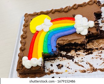 Chocolate Rainbow Sheet Cake With Colorful Frosting Cut On White Tray