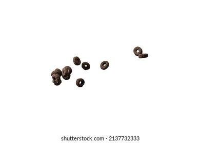 Chocolate Rings Cereal Spill Out Into A Bowl. Breakfast. Isolated On A White Background. 