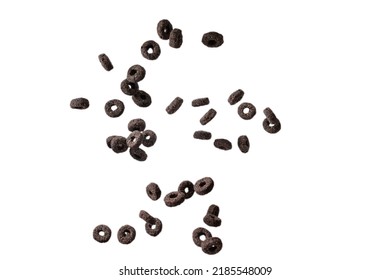 Chocolate Rings Cereal Spill Out Into A Bowl. Breakfast. Isolated On A White Background. 