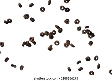 Chocolate Rings Cereal Spill Out Into A Bowl. Breakfast. Isolated On A White Background. 