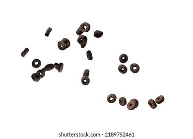 Chocolate Rings Cereal Spill Out Into A Bowl. Breakfast. Isolated On A White Background. 