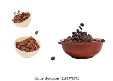 Chocolate Rings Cereal Spill Out Into A Bowl. Breakfast. Isolated On A White Background. 