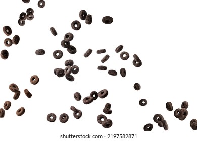 Chocolate Rings Cereal Spill Out Into A Bowl. Breakfast. Isolated On A White Background. 