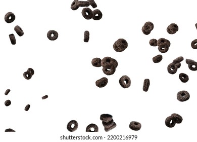 Chocolate Rings Cereal Spill Out Into A Bowl. Breakfast. Isolated On A White Background. 