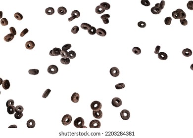 Chocolate Rings Cereal Spill Out Into A Bowl. Breakfast. Isolated On A White Background. 