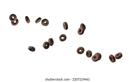 Chocolate Rings Cereal Spill Out Into A Bowl. Breakfast. Isolated On A White Background. 