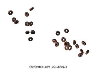 Chocolate Rings Cereal Spill Out Into A Bowl. Breakfast. Isolated On A White Background. 