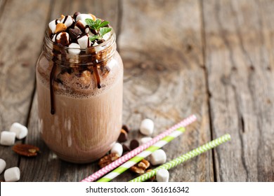 Chocolate shake with dripping sauce and marshmallows