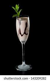 Chocolate Shake Served In A Champagne Flute Garnished With Fresh Mint