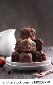 chocolate brownie or simply a brownie is a square or rectangular chocolate baked confection. Brownies come in a variety of forms and may be either fudgy or cakey, depending on their density. 