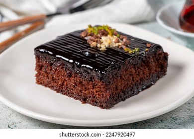 Chocolate slice cake on gray background. Chocolate moist cake. Bakery desserts. close up