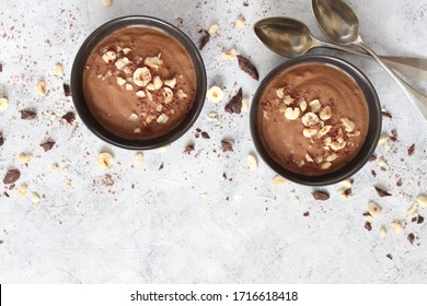 Chocolate smoothie with banana and nuts. Top view with copy space. Protein smoothie.