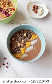 Chocolate Smoothie Bowl With Chocolate Chips, Coconut, Mango, Nuts And Vegan Milk. Vegan And Vegetarian Dishes For Breakfast . Insta Food Photo. Stylish Healthy Recipes 