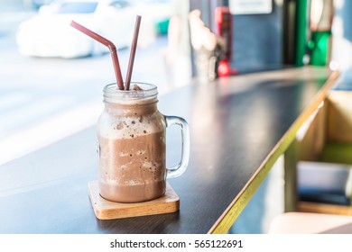 Chocolate smoothie (milkshake) with jar in cafe