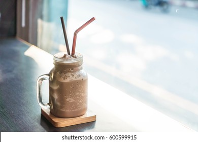 Chocolate smoothie (milkshake) with jar in cafe
