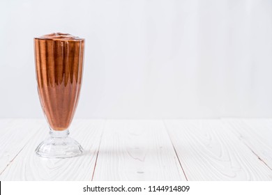 chocolate smoothies milkshake on wood background