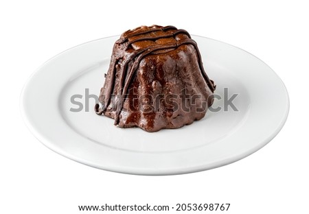 Chocolate souffle on white porcelain plate on an isolated white background