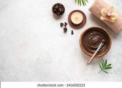 Chocolate Spa flat lay on white background, top view. Natural spa beauty products with chocolate.