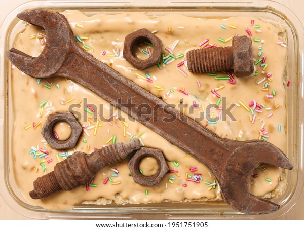 chocolate spanner and nuts, an unusual cake\
decoration for dad