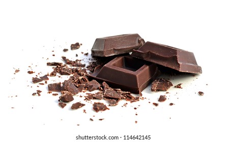 Chocolate Squares And Crumbles On White Background