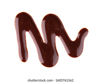 Chocolate Syrup Drizzle Isolated On White Background. Splashes Of Sweet Chocolate Sauce. Top View.