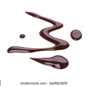 Chocolate Syrup Drizzle Isolated On White Background. Splashes Of Sweet Chocolate Sauce. Top View.