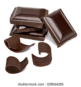 Chocolate tablets stack and curls on white background
