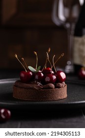 Chocolate Tart With Ganache Decorated With Cherry