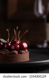 Chocolate Tart With Ganache Decorated With Cherry