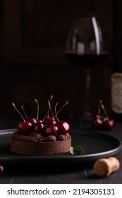 Chocolate Tart With Ganache Decorated With Cherry