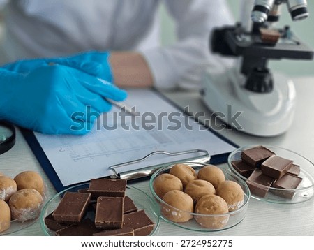 Chocolate testing process in a laboratory with various samples and equipment present during analysis