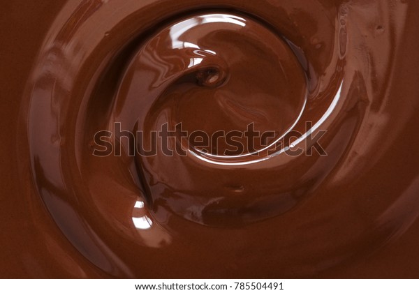 Chocolate texture. Liquid chocolate\
close-up.Textured dark\
chocolate